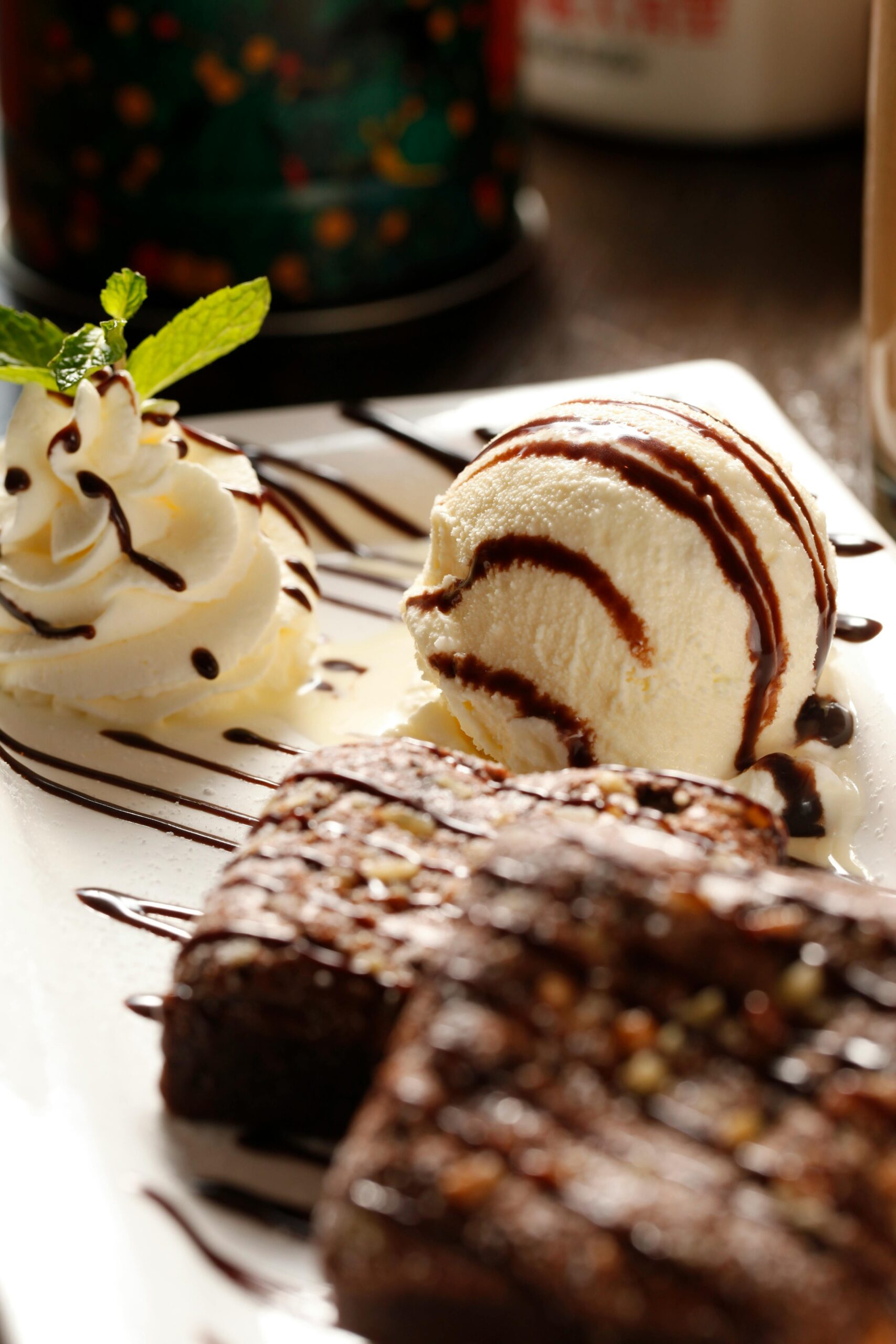 Indulge in a rich chocolate brownie paired with creamy vanilla ice cream and a whipped cream topping — the perfect sweet ending after enjoying popular Italian foods like Margherita Pizza, Fettuccine Alfredo, and Tiramisu, all inspired by the flavors found in top Italian restaurants.